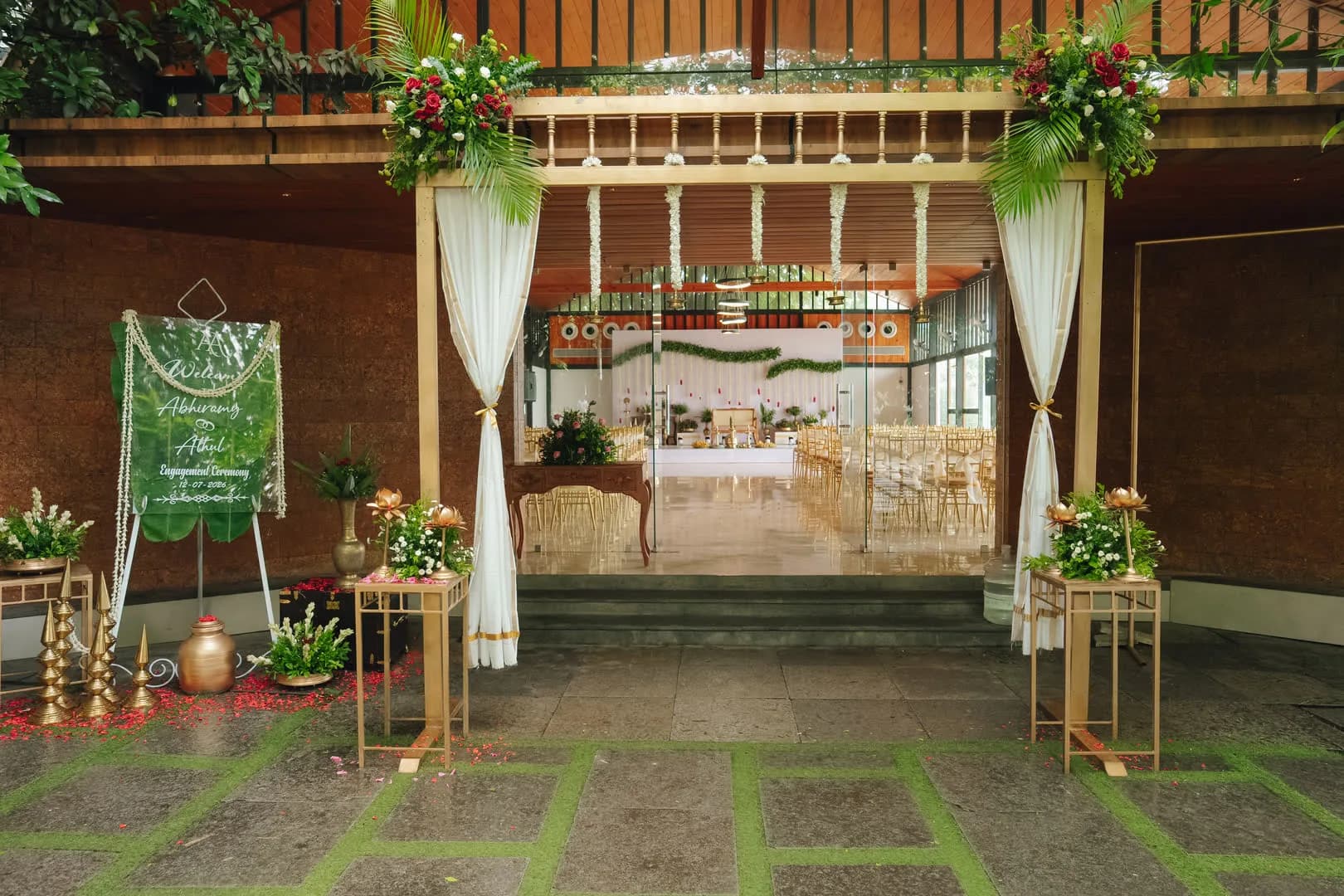 Floral entrance archway leading into an engagement ceremony hall