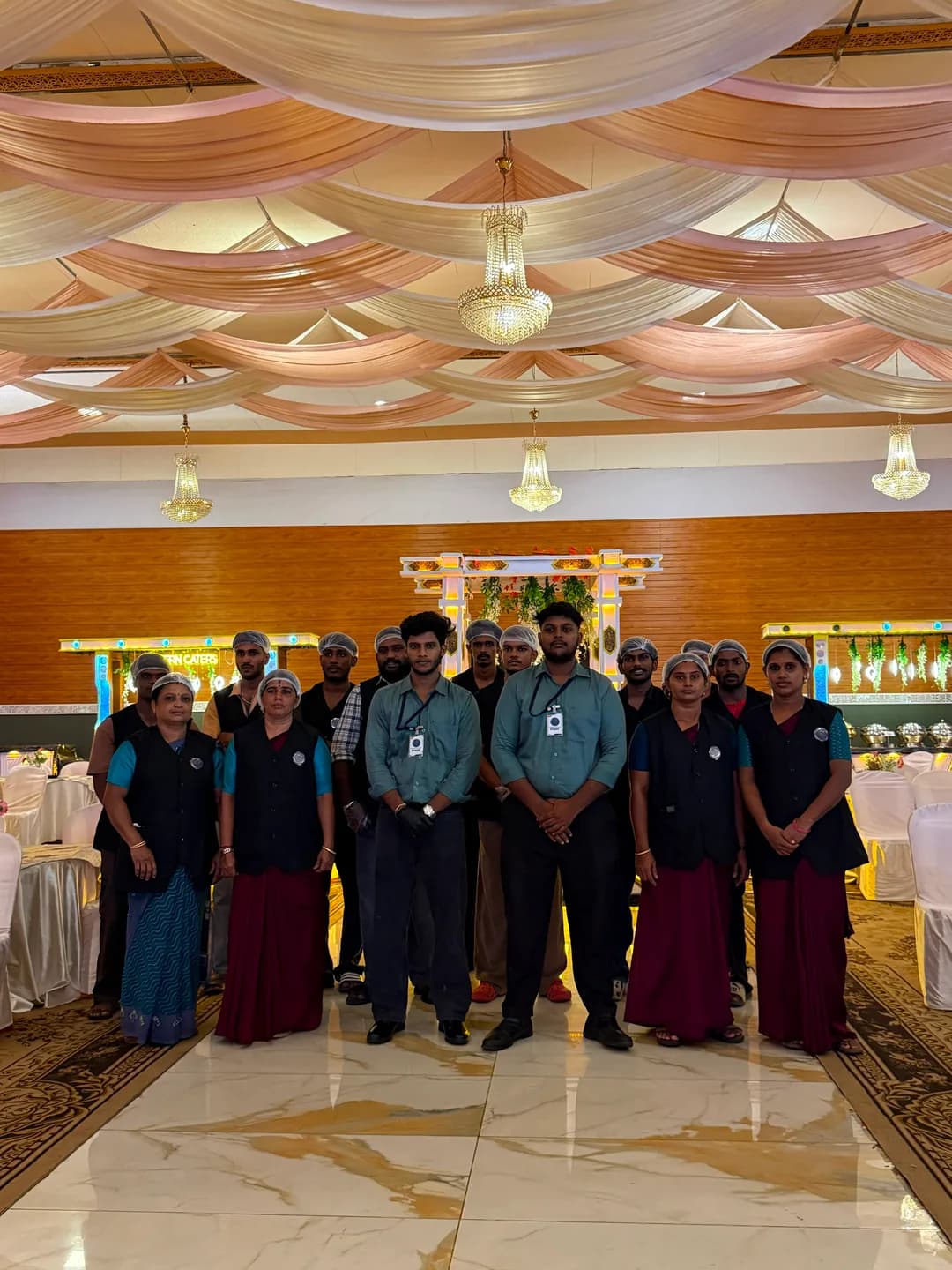 Our uniformed team ready to serve in a draped banquet hall